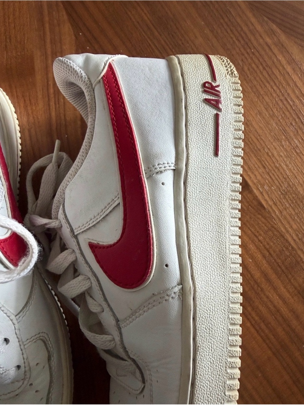 Nike Air Force White Sneakers with Red Nike Logo